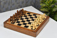 Genuine ebony chess pieces set up for play on the included 30cm ebony and maple travel board