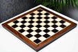 Ebony and maple chess board with a sheesham border, 58cm with 60mm squares
