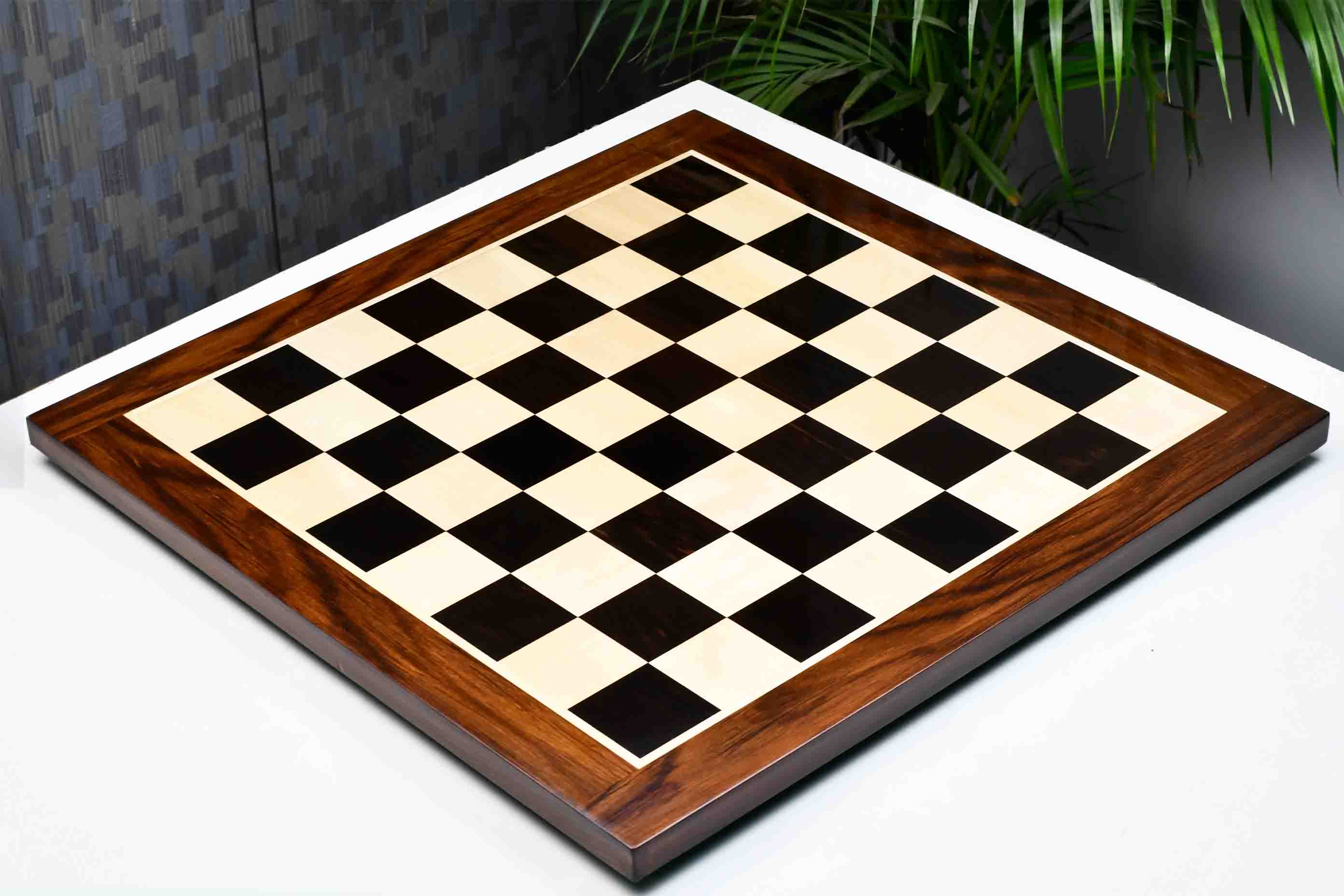 Ebony and maple chess board with a sheesham border, 58cm with 60mm squares