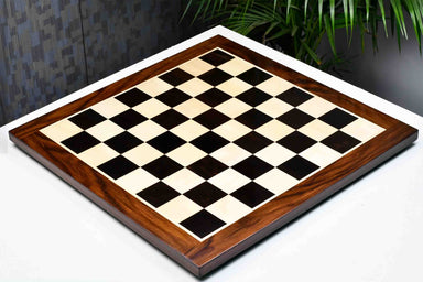 Ebony and maple chess board with a sheesham border, 58cm with 60mm squares