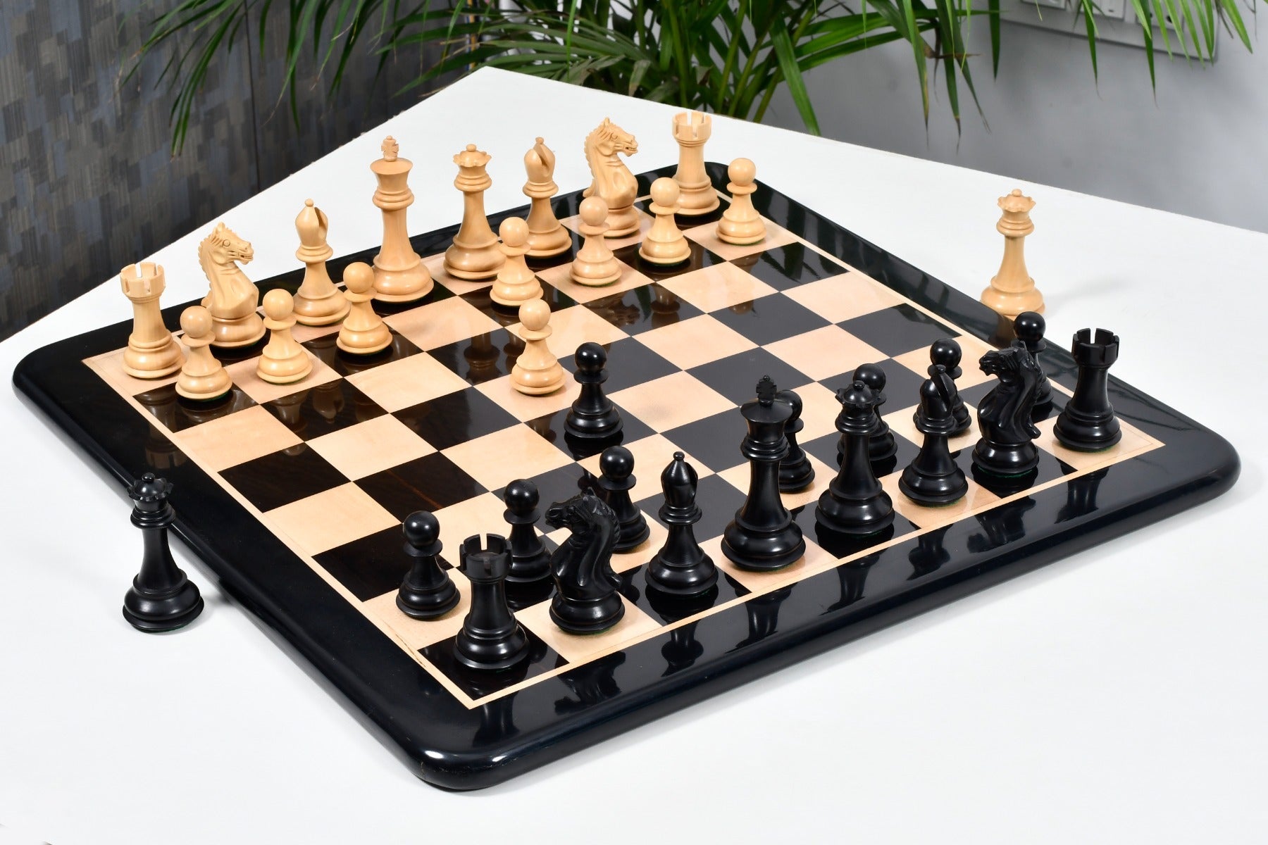 Fierce Knight chess set with two spare queens in ebonised boxwood