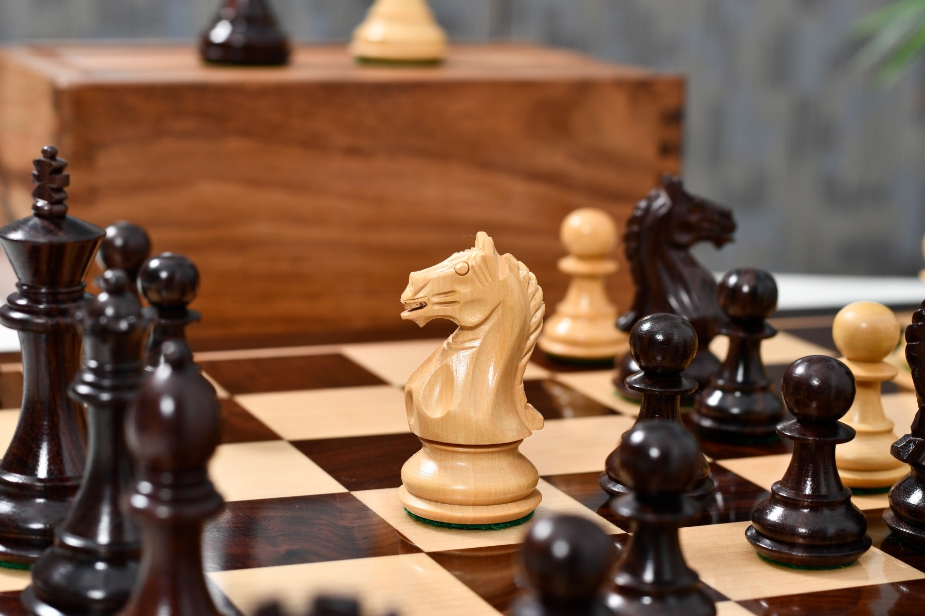 Knight carving detail on the Fierce Knight Staunton chess pieces in rosewood and boxwood