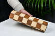 Folding sheesham and maple chess board at an angle