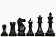 Ebonised chess pieces with a 95mm king and felted bases