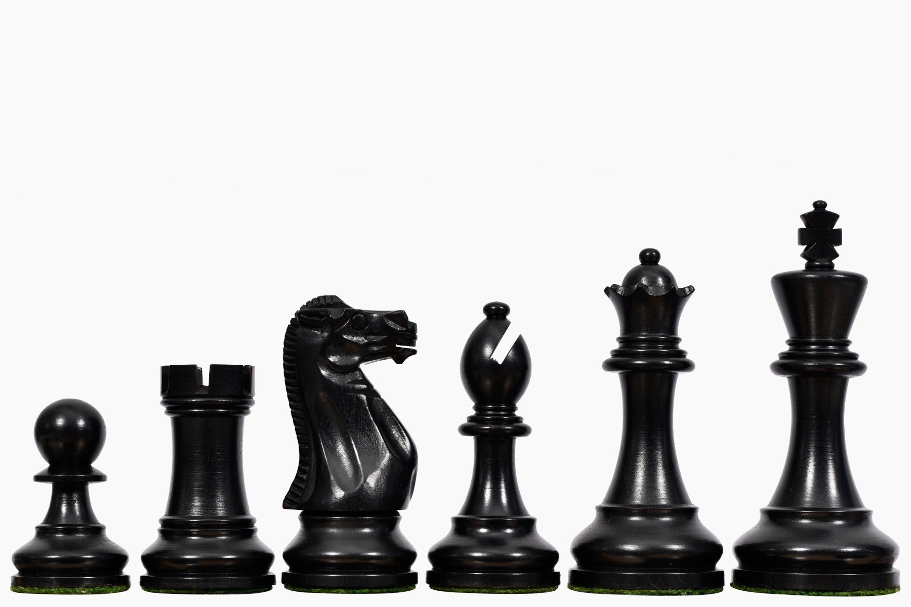 Ebonised chess pieces with a 95mm king and felted bases