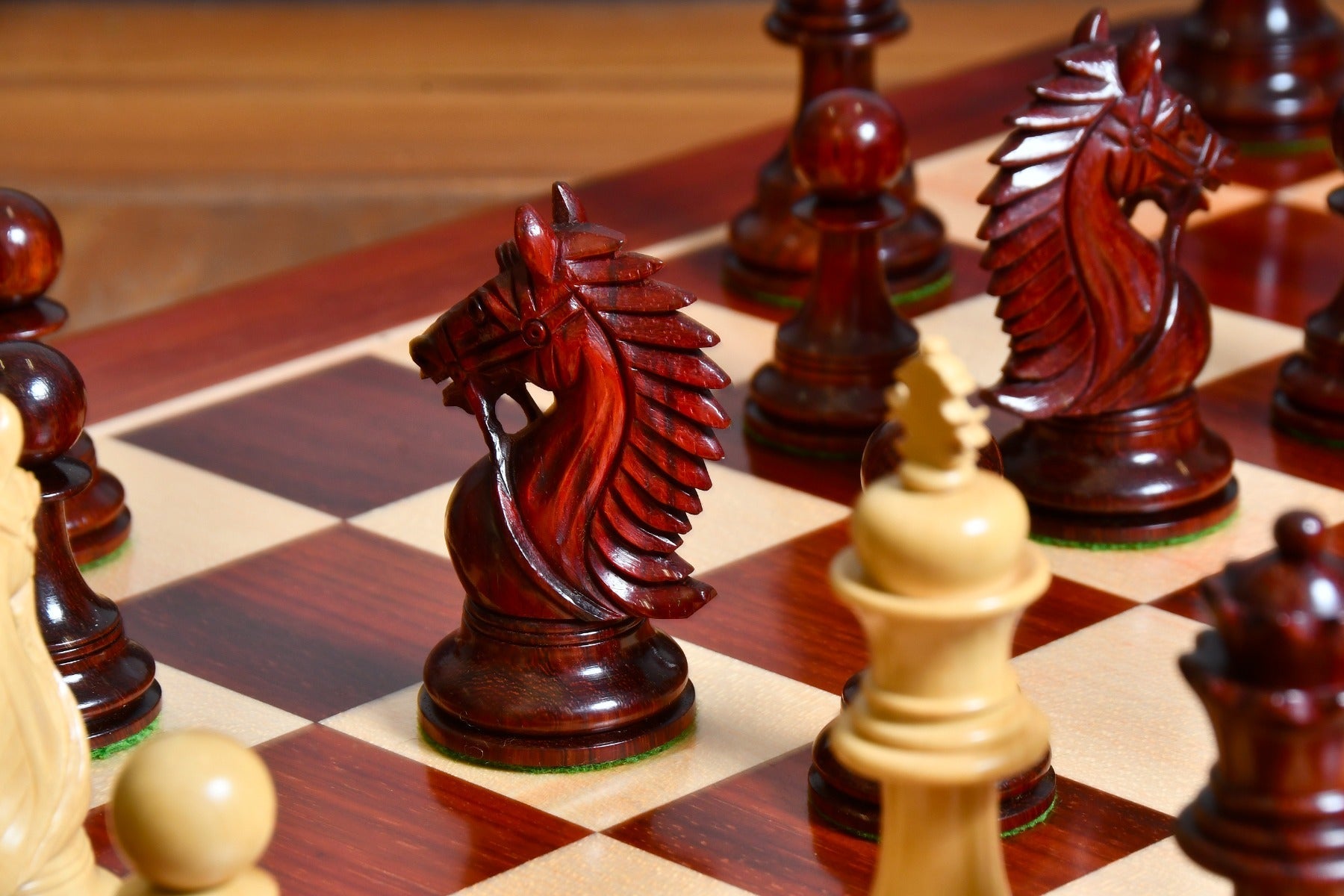 Bud rosewood chess pieces with a 107mm king and weighted felted bases