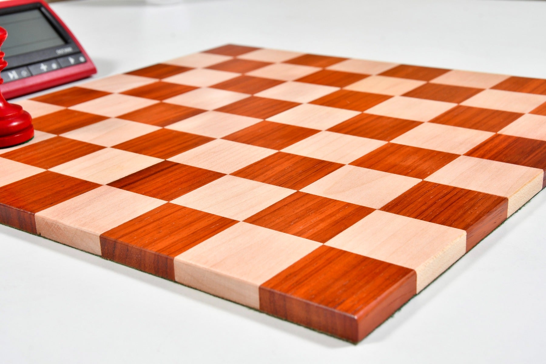 Indian folding bud rosewood and maple chess board, 32.5cm