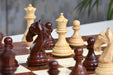 Bud rosewood chess pieces set up for play on the included 55cm red ash burl and maple board