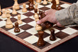 Sheesham chess pieces set up for play on the included 48cm folding notation board