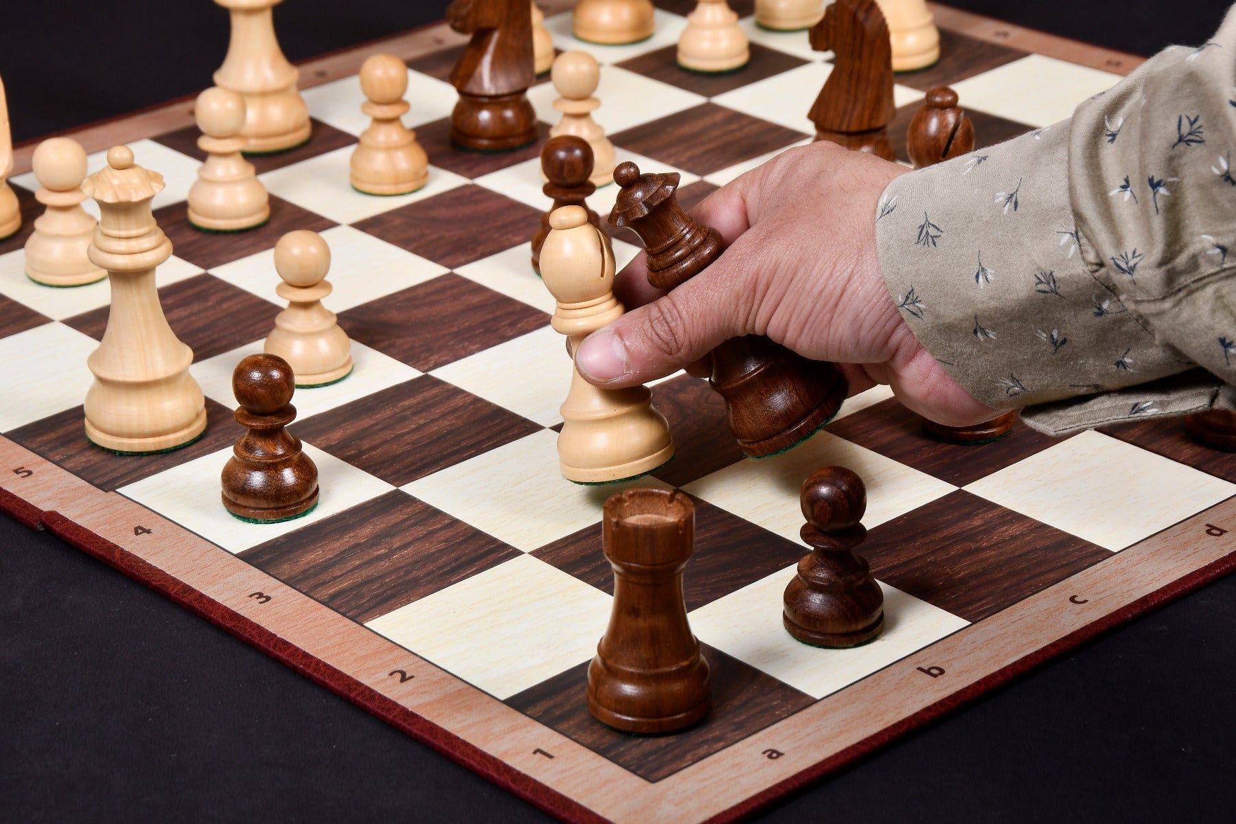 Sheesham chess pieces set up for play on the included 48cm folding notation board