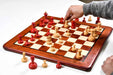 Stained crimson and natural boxwood Knubbel pieces, 2.91 inch king