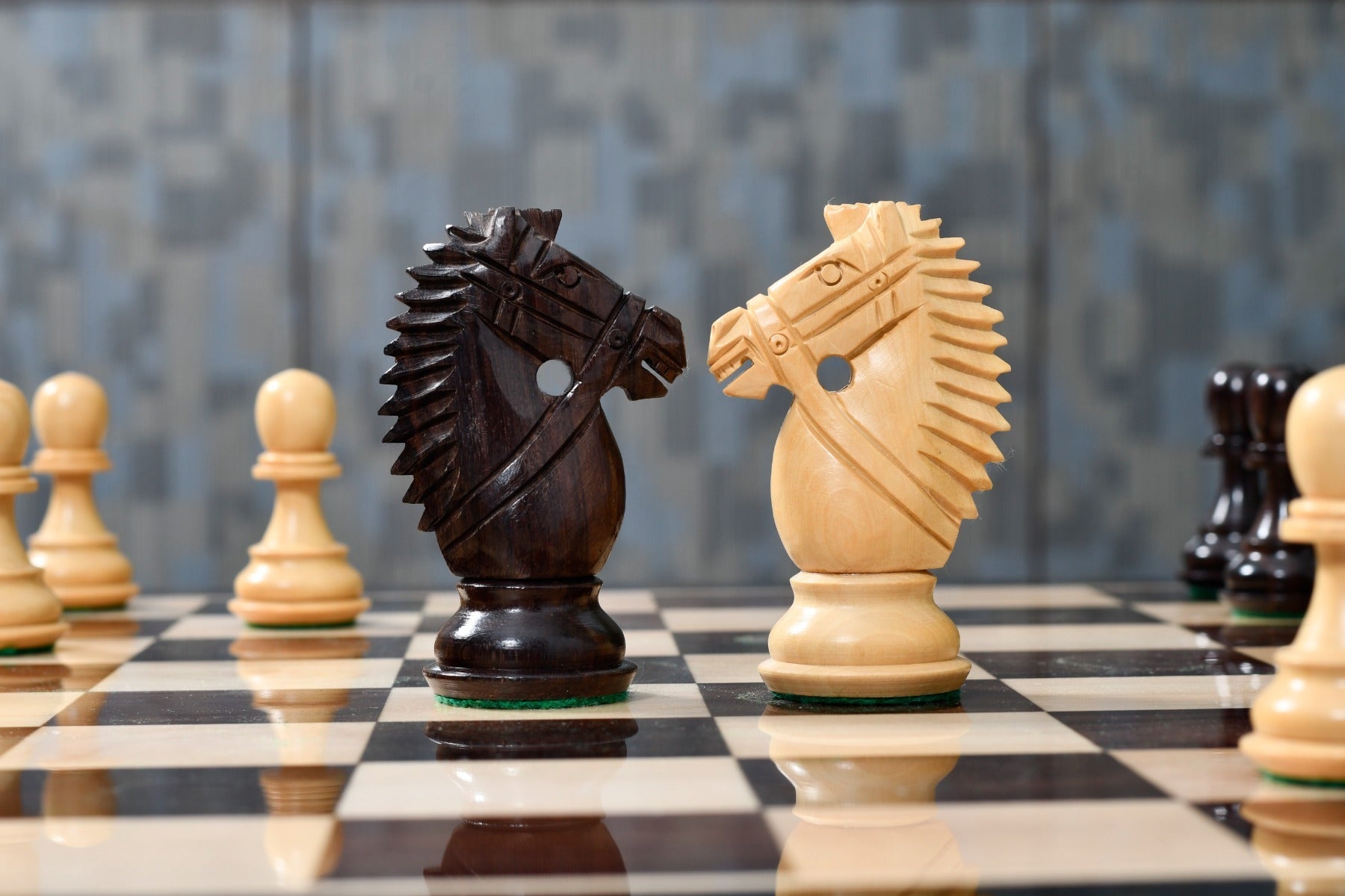 Knight carving detail on the Bridle Knight Series chess pieces in rosewood and boxwood