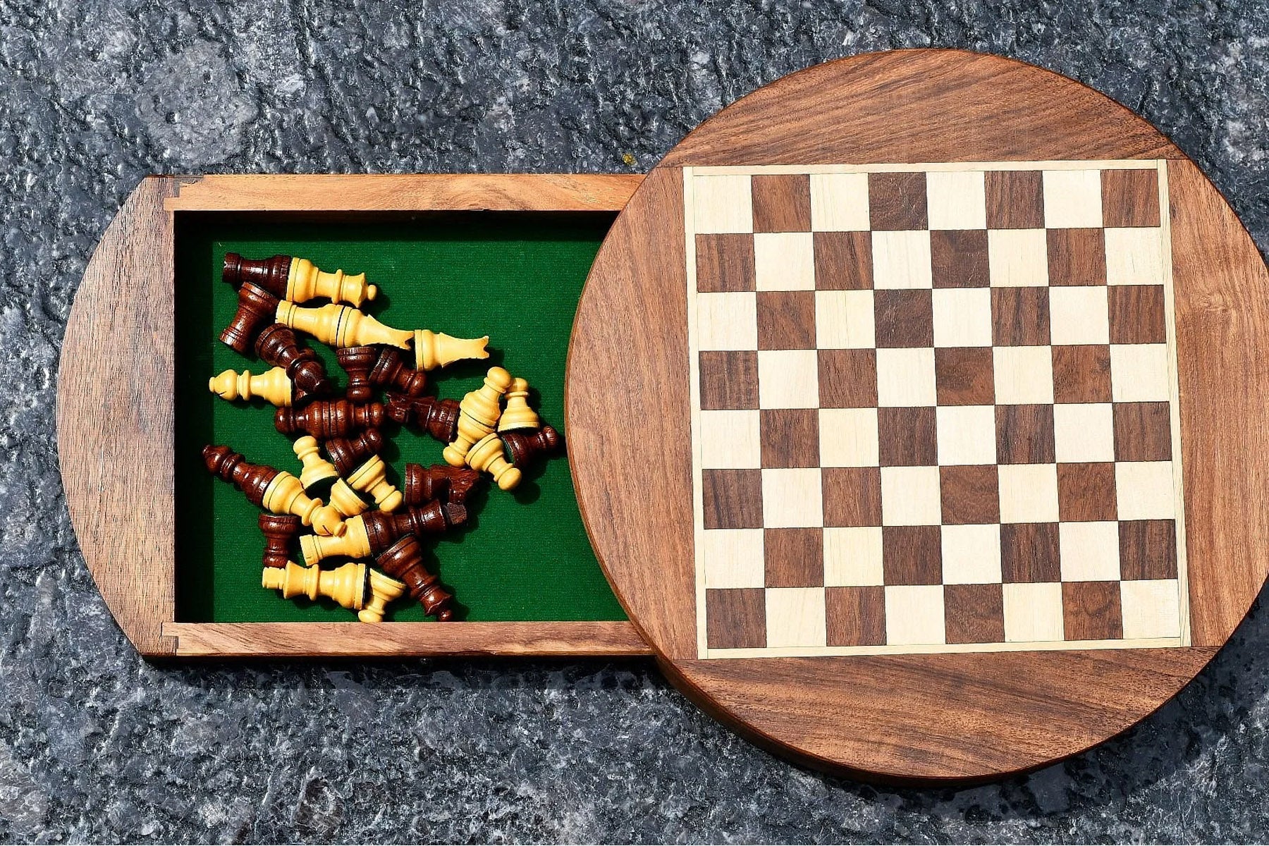 Round magnetic travel chess pieces with a 33mm king in sheesham and maple