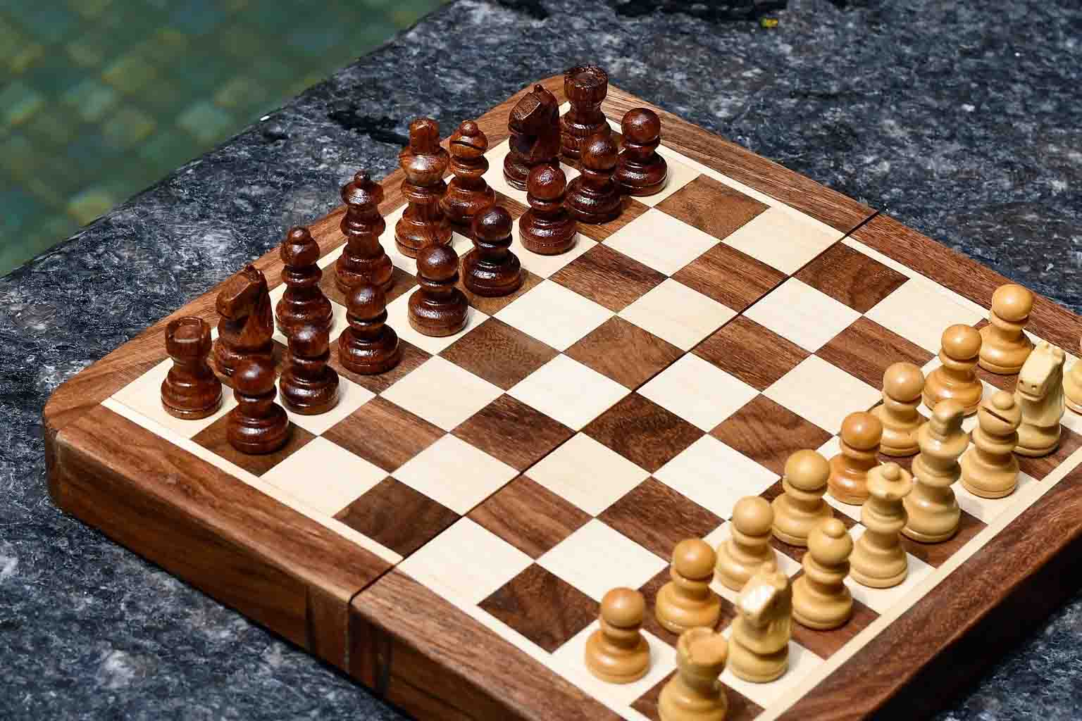 Seven inch folding travel chess set opened flat for play
