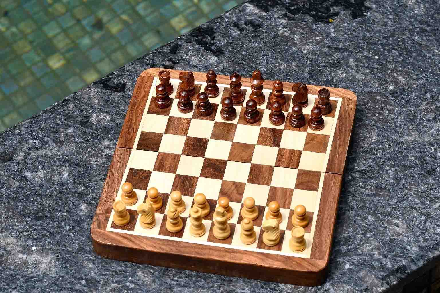 Folding magnetic travel chess pieces with a 26mm king in sheesham and maple