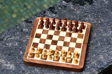 Folding magnetic travel chess pieces with a 26mm king in sheesham and maple
