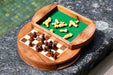 Sheesham and maple round travel chess set viewed from above