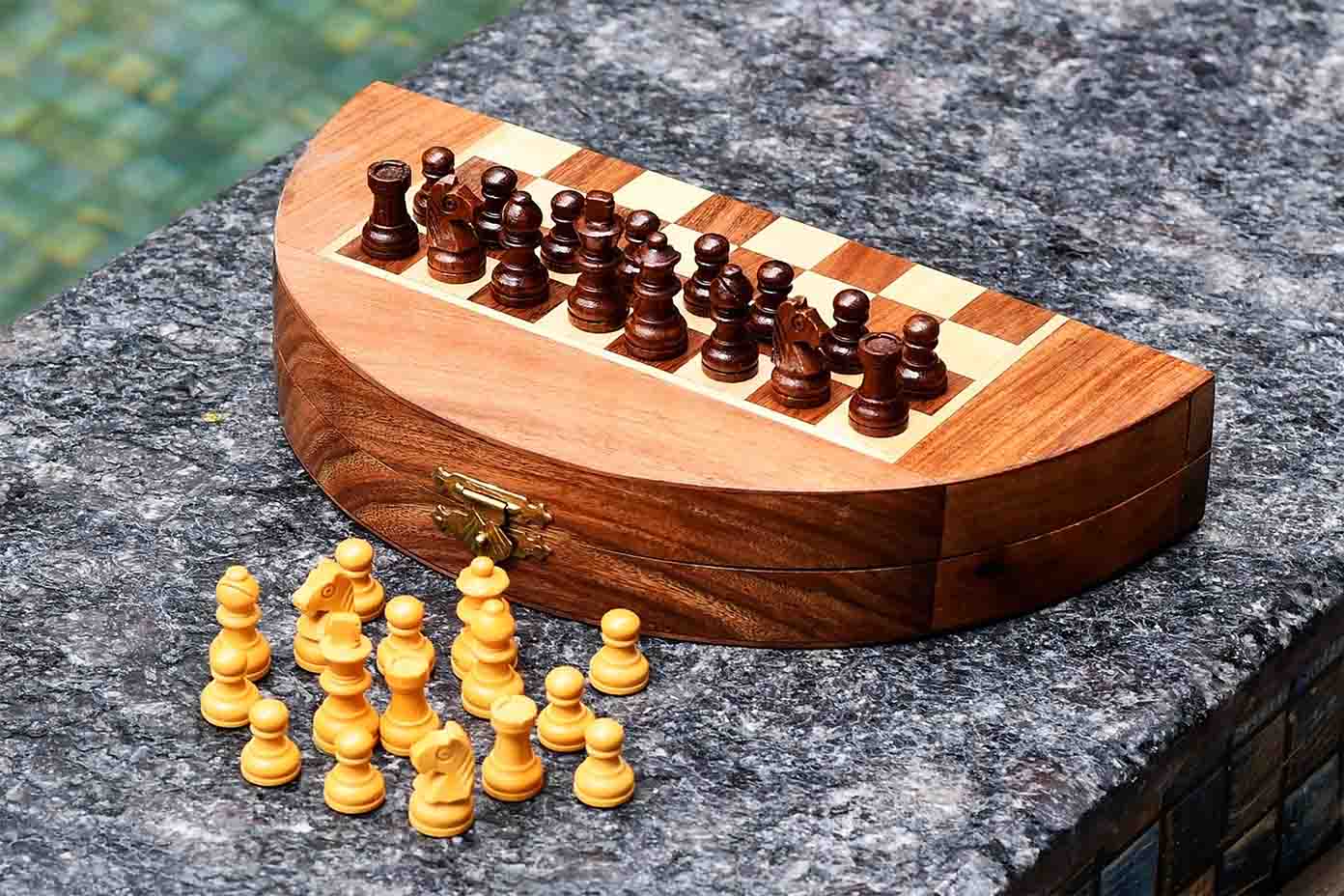 Round folding travel chess set opened flat for play