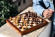 Travel Series folding magnetic chess set in lacquered sheesham and maple, 60mm king