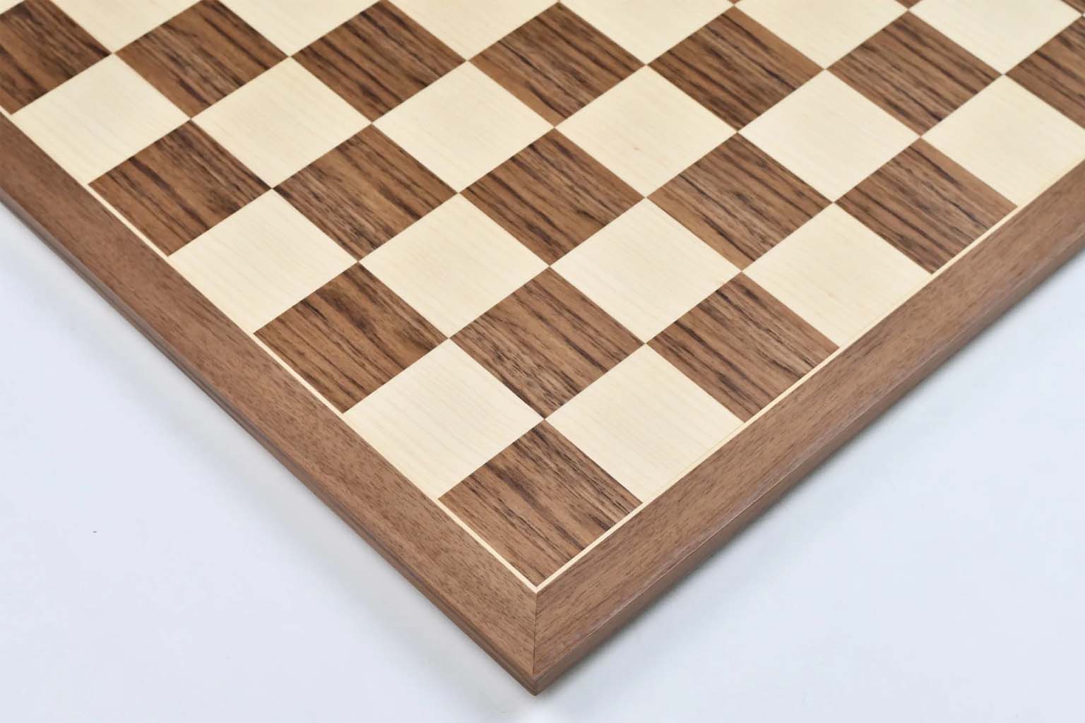 Walnut and maple chess board photographed from above