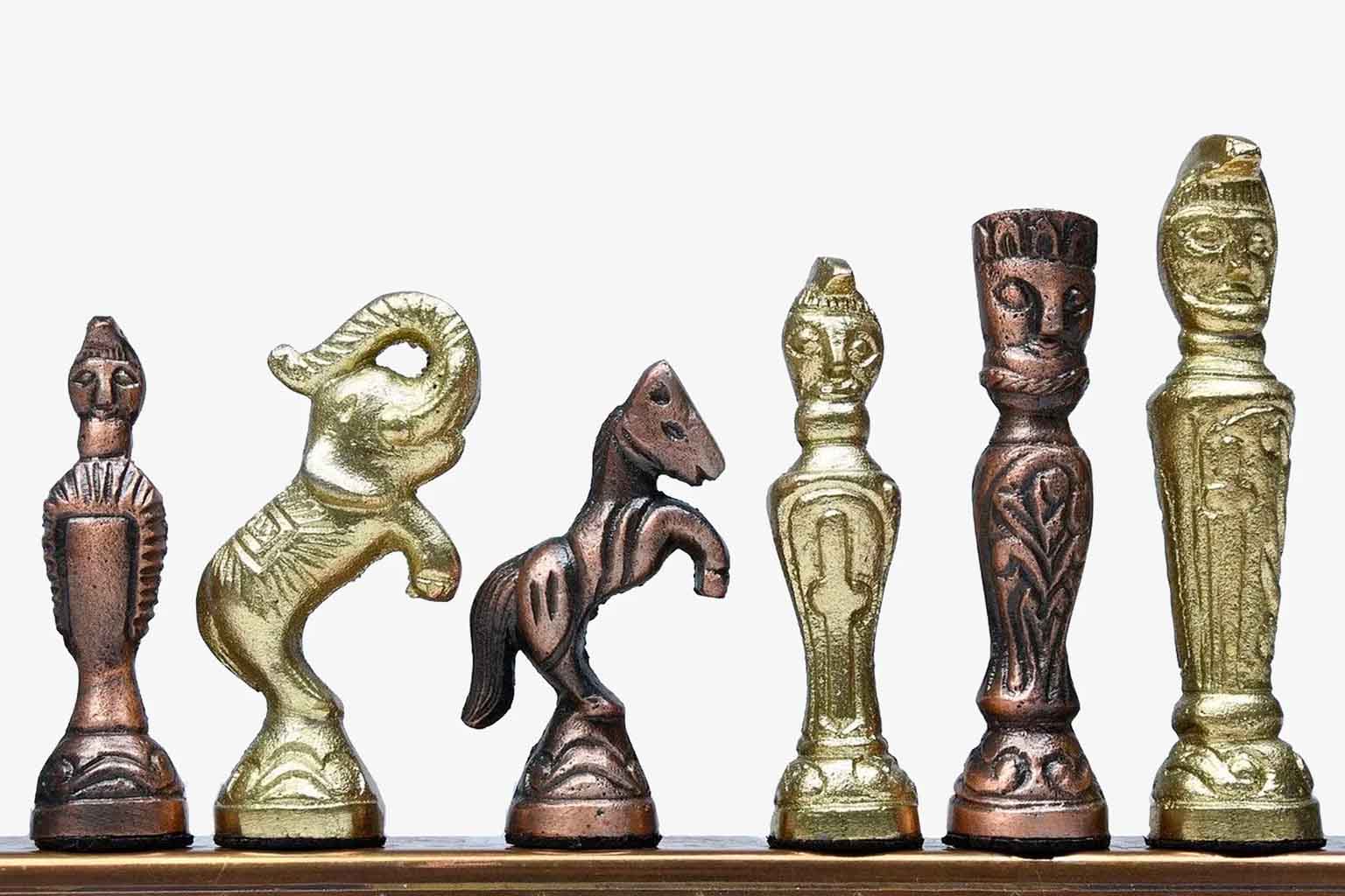 Antique brass vintage chess pieces, detail of the crowned king
