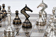 Brass metal chess set in shiny silver and black with a 35cm board