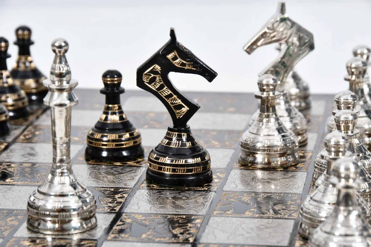 Brass metal chess set in shiny silver and black with a 35cm board