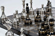 Shiny silver and black brass metal chess set for display and play
