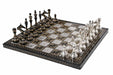 Silver and black brass Staunton chess pieces on 40mm squares
