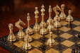 Gold and black brass Staunton chess pieces on 40mm squares