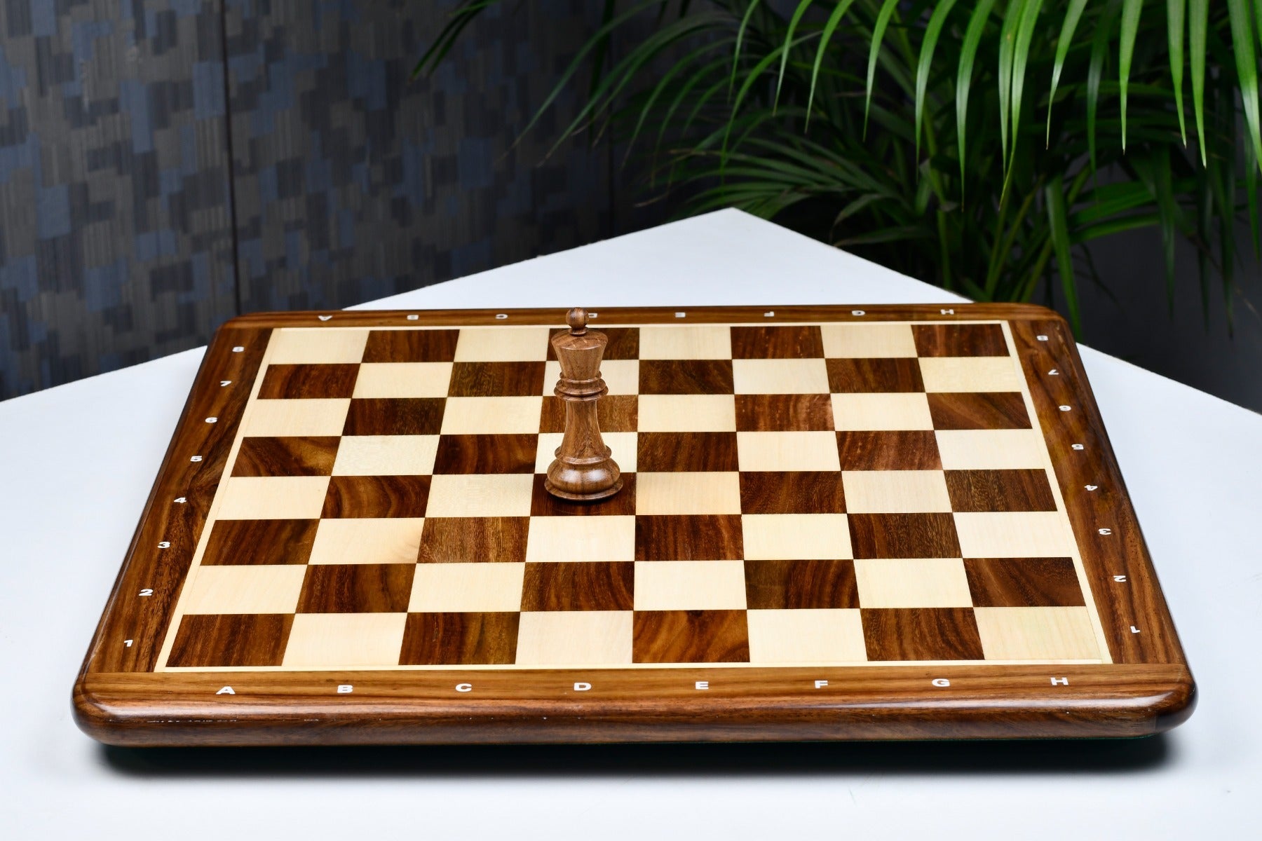 Sheesham and maple 19 inch notation chess board showing its 22mm thickness