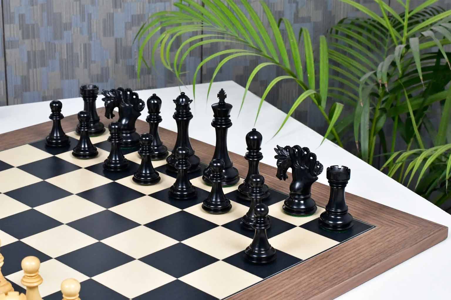 Ebony and boxwood Pegasus Artisan chess pieces, 118mm king, with the 60cm black dyed poplar and sycamore board