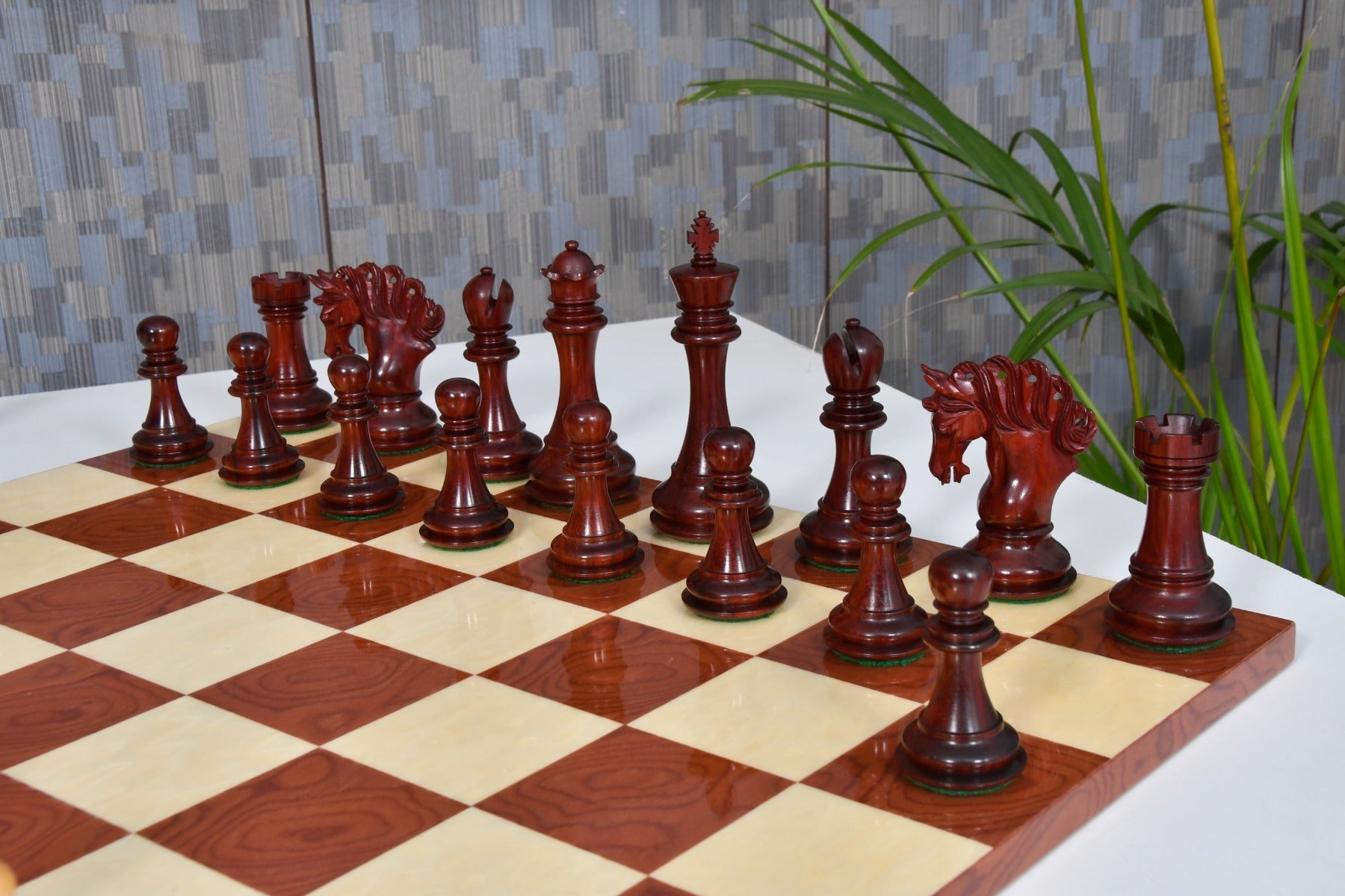 Bud rosewood and boxwood Pegasus Artisan chess pieces, 118mm king, with the 48cm red ash burl and maple board