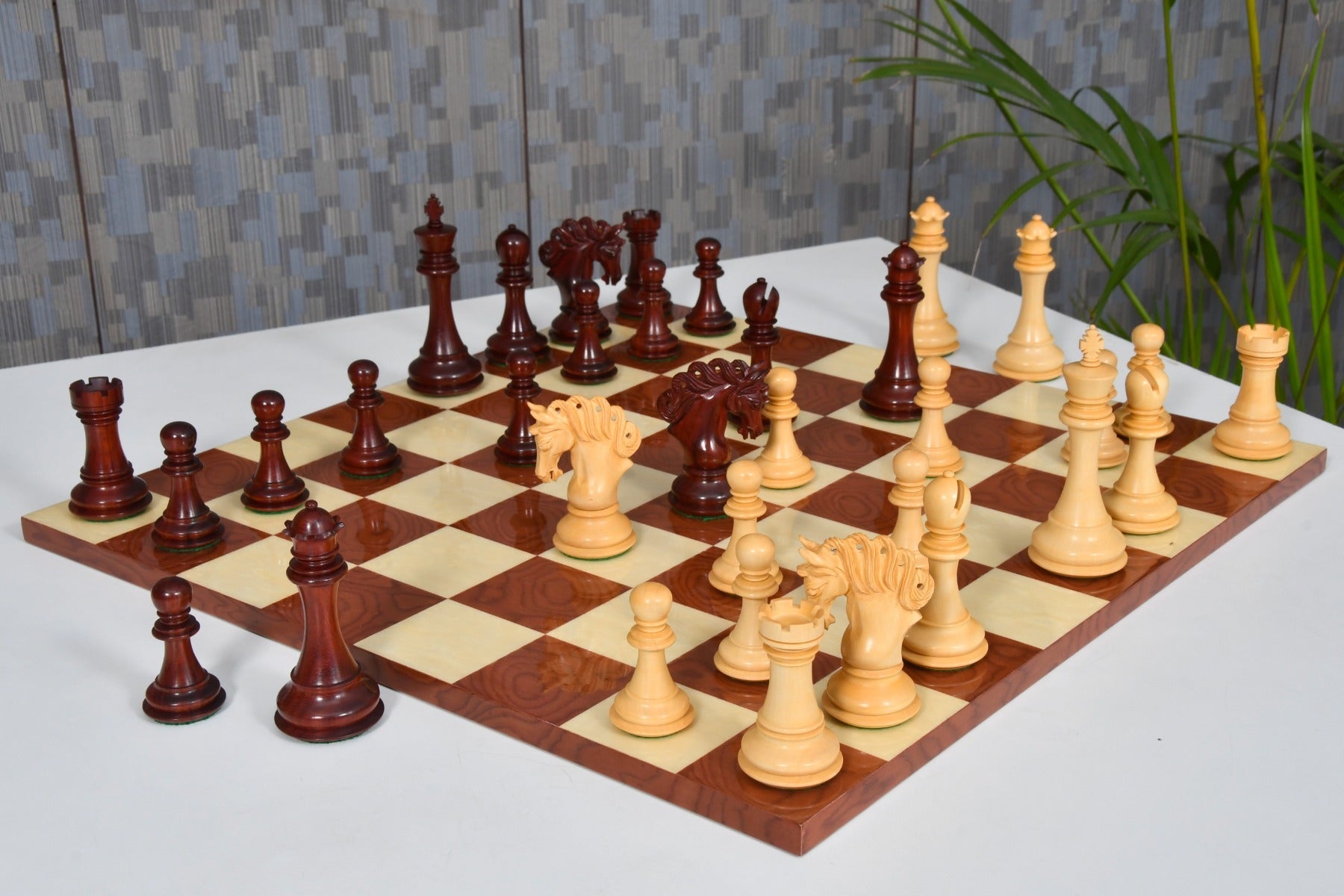 Pegasus V2.0 bud rosewood chess set on a borderless hi-gloss board
