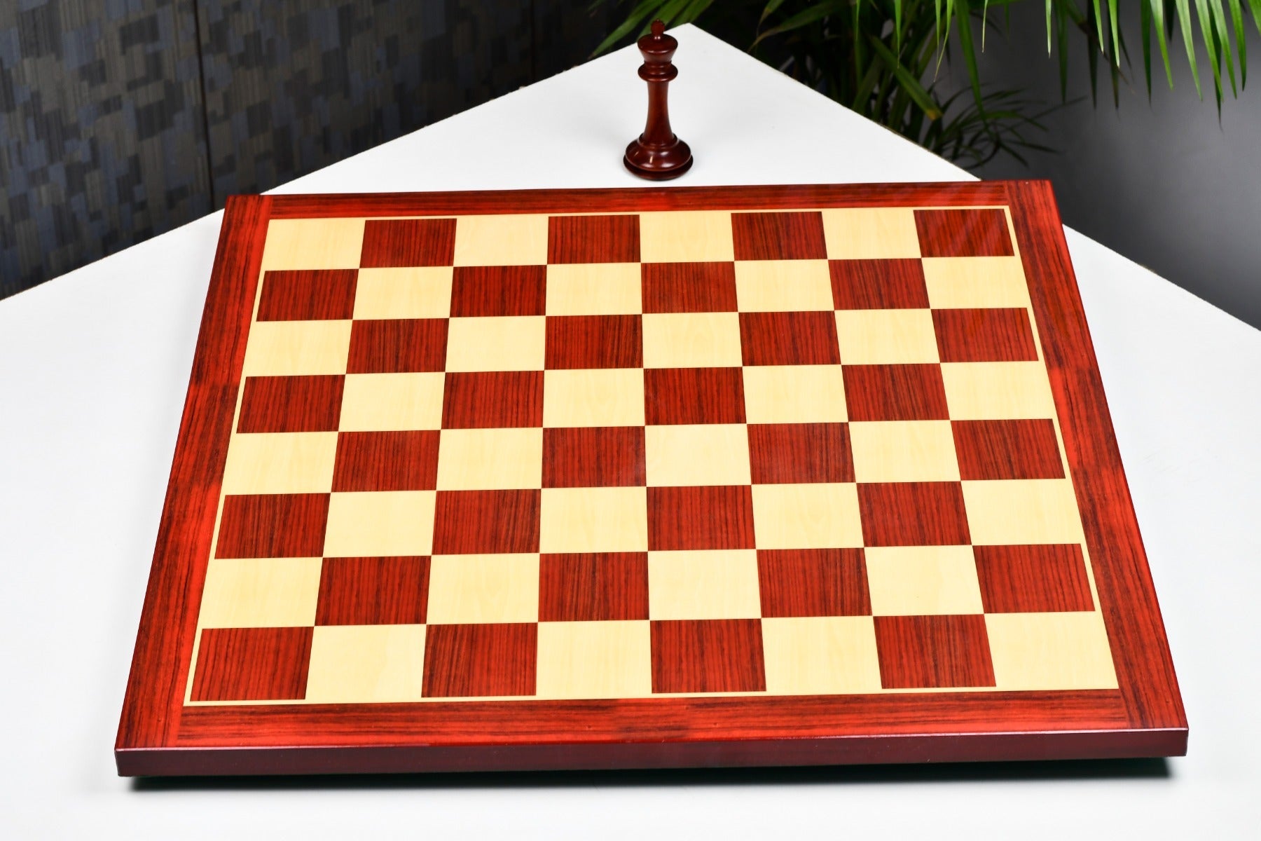 Rosewood grain tournament chess board at an angle