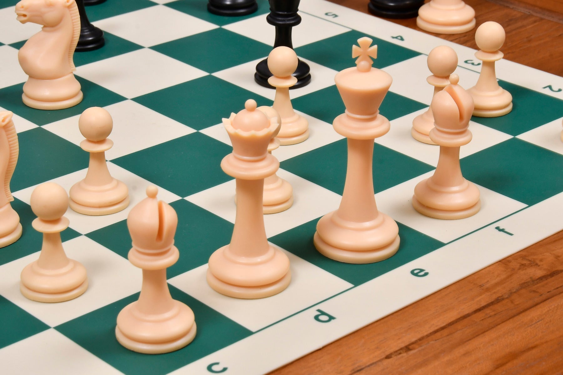 Full 34 piece International Series plastic chess set in black and natural white plastic