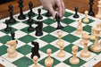 Natural white and black plastic chess pieces with a 97mm king