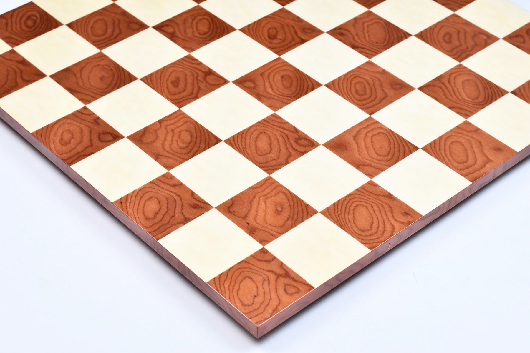Borderless red ash burl chess board photographed from above