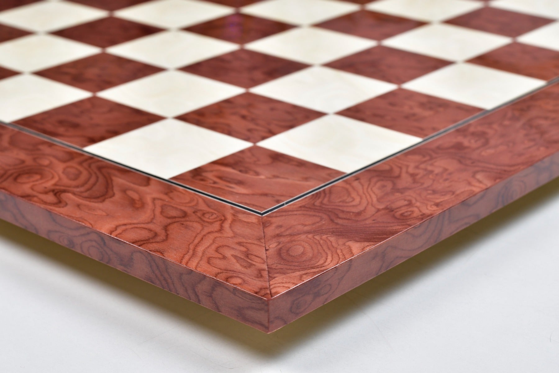 Hi-gloss red ash burl and maple chess board, edge view