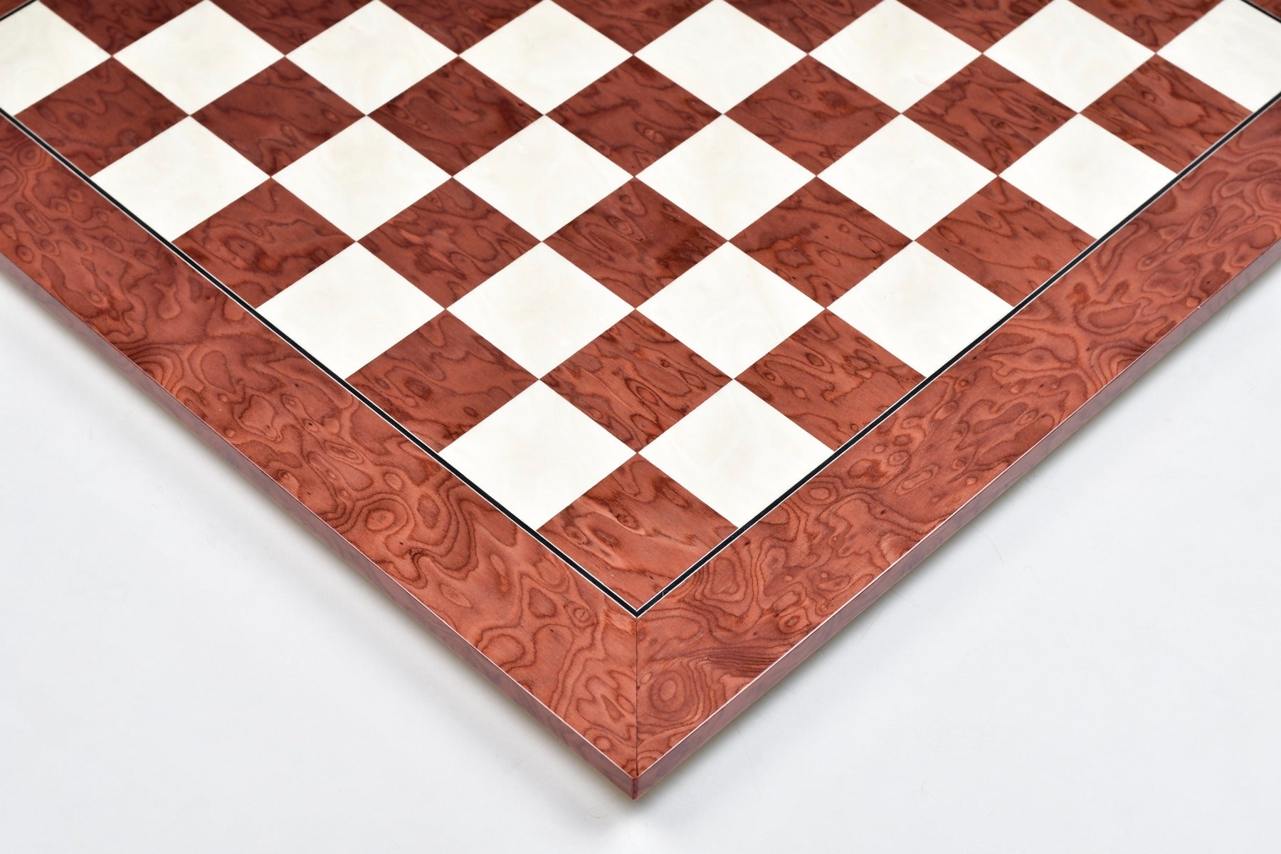 Red ash burl hi-gloss chess board photographed from above