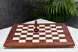 Red ash burl and maple chess board at an angle