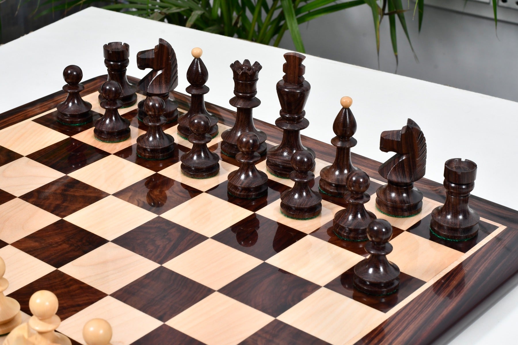 Rosewood chess pieces with a 98mm king and felted bases