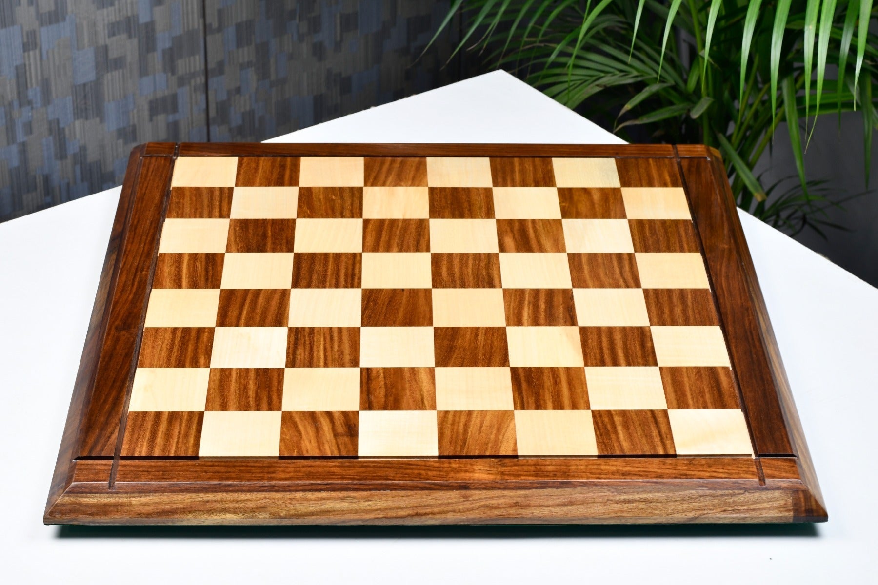 Deluxe sheesham and maple chess board at an angle
