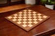 Walnut and maple veneer chess board, 54cm with 60mm squares
