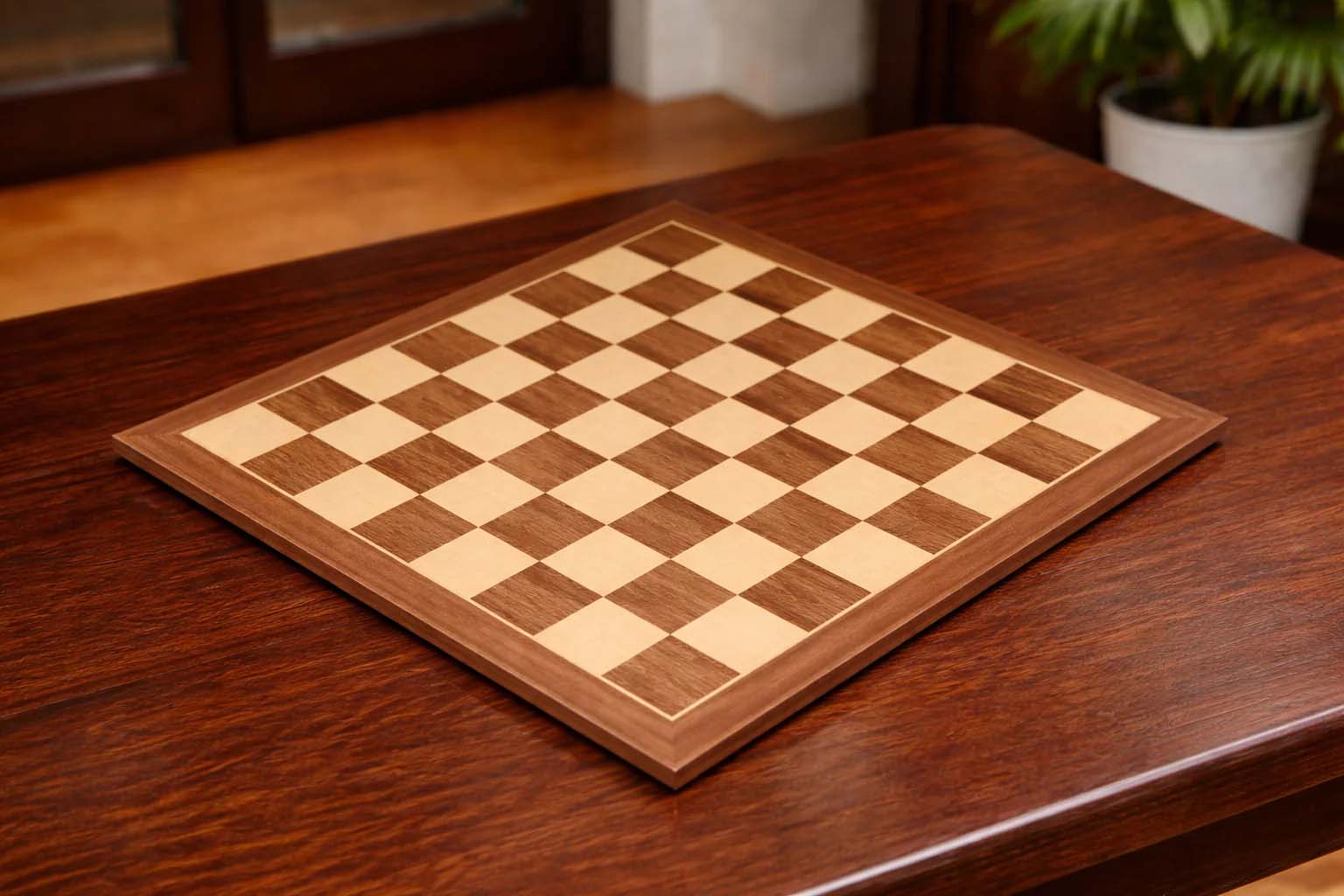 Walnut and maple veneer chess board, 54cm with 60mm squares