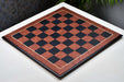 Black anigre and red ash burl chess board with moulded edges, 60cm