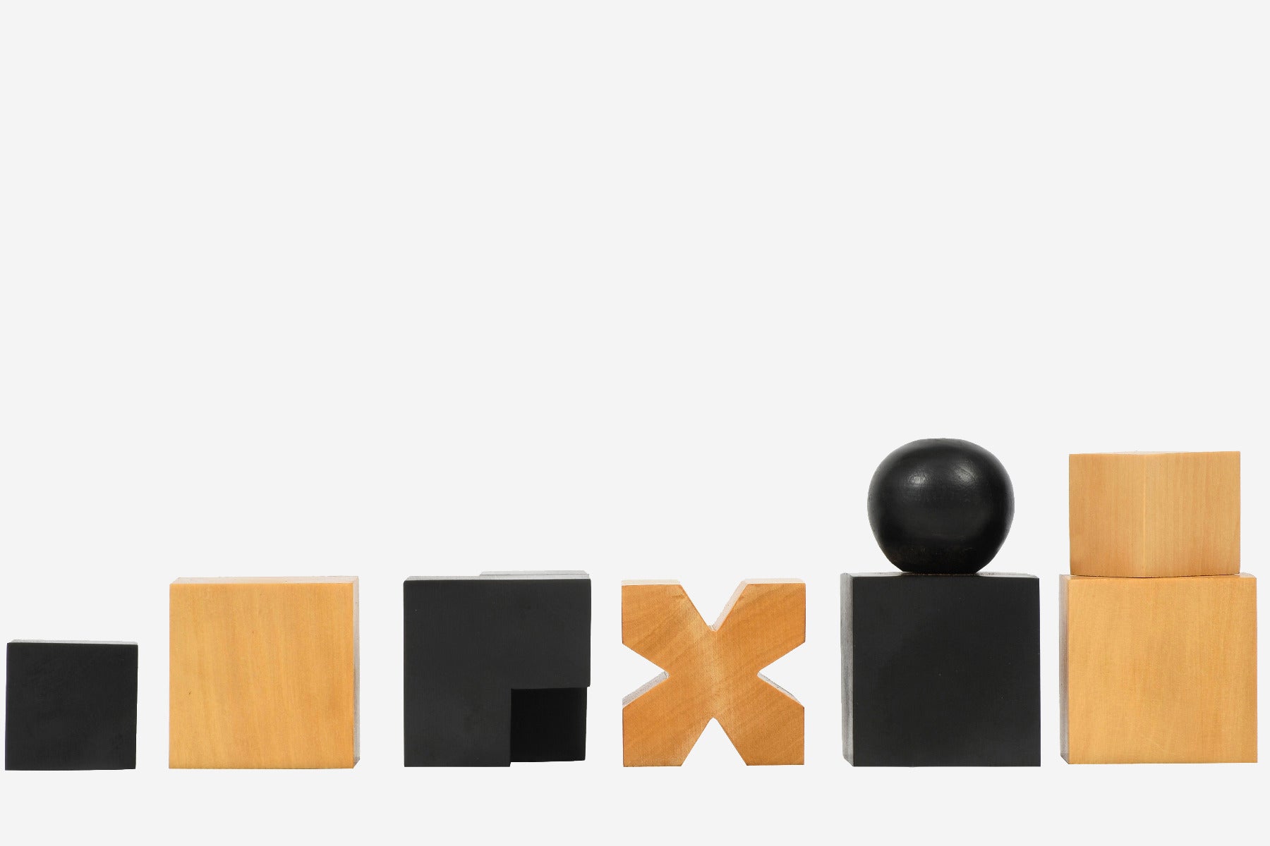 Sterling Chess 1924 Bauhaus Geometrical chess pieces in ebonised and natural boxwood, 49mm king