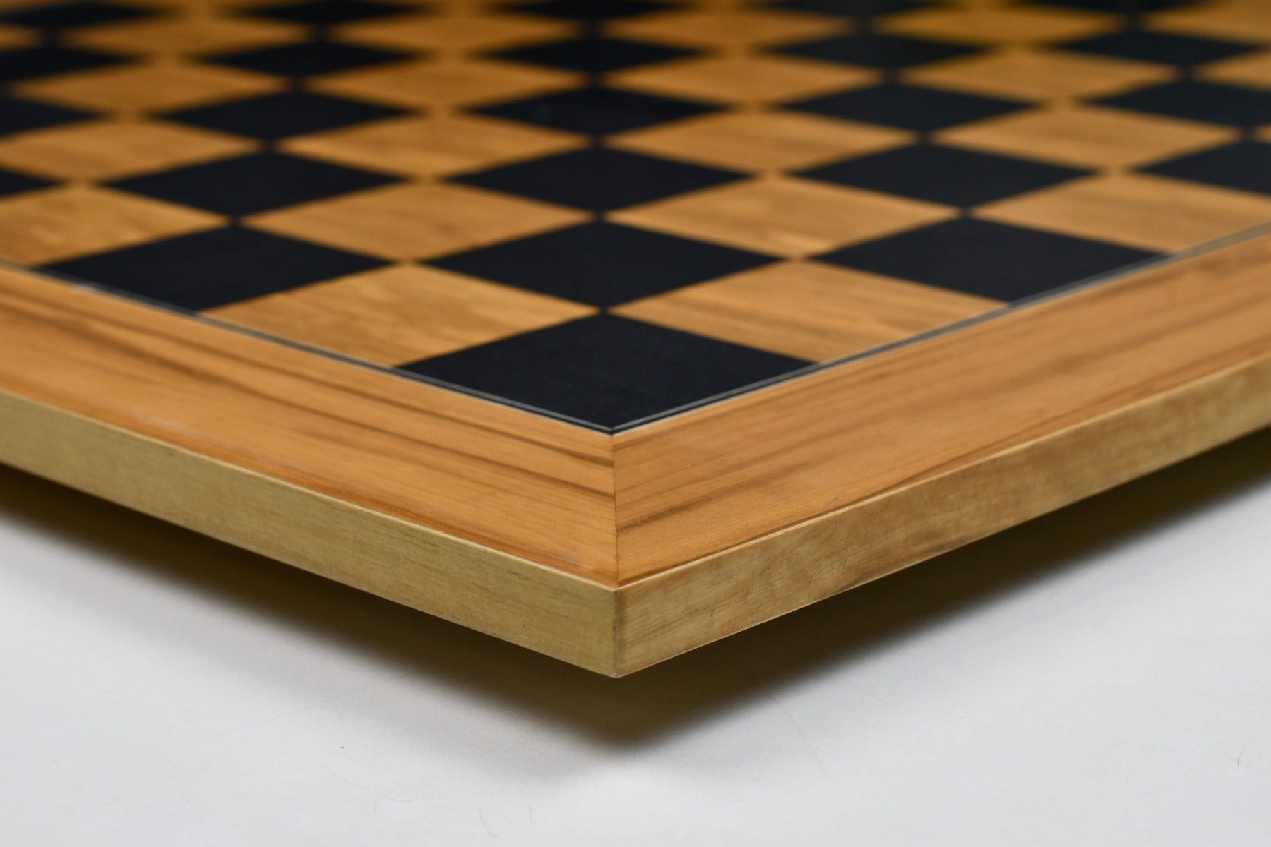 Matte finish black dyed poplar and olive chess board, edge view